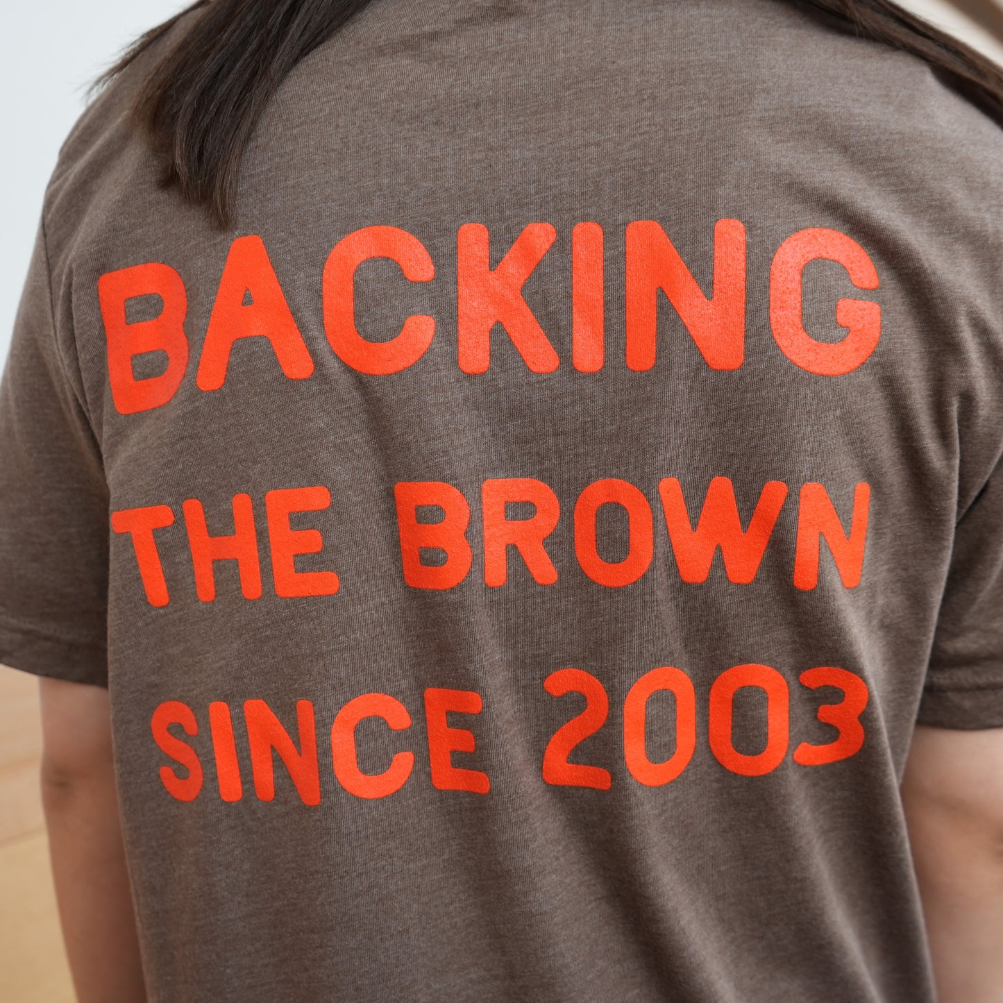 Backing the Brown T-Shirt